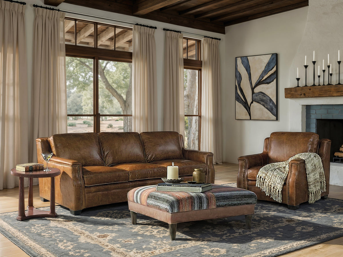 a living room with leather furniture and a couch