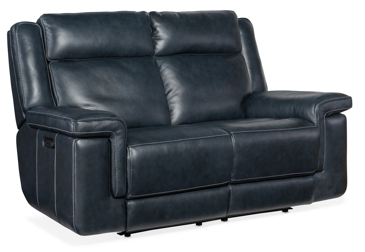 a black leather couch with white stitching