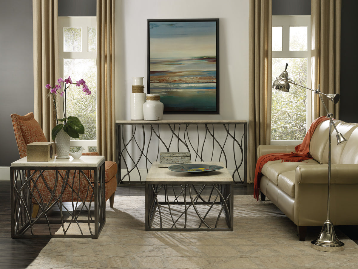 a living room with a couch and a painting on the wall