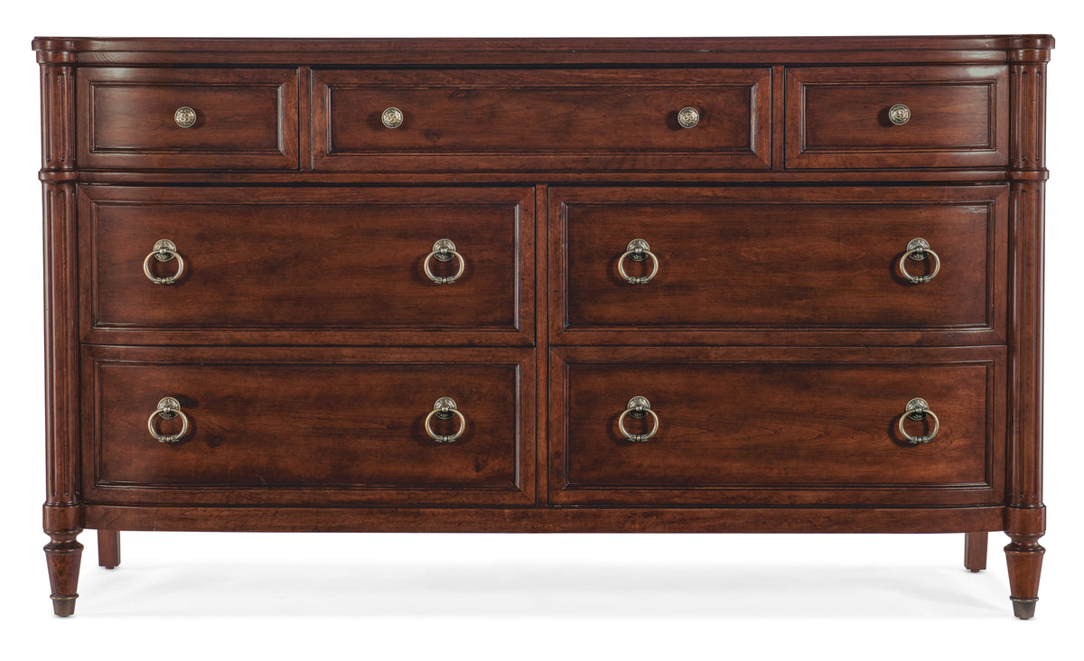 a brown dresser with gold handles
